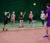 the-young-man-in-a-closed-tennis-court-with-ball